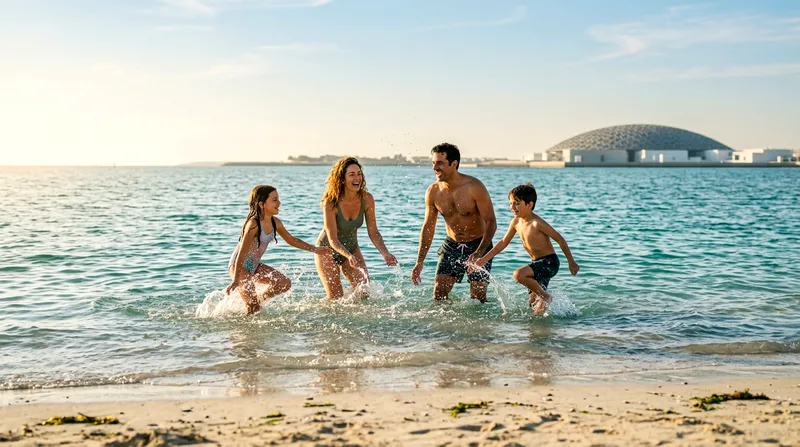 Family of four playing in shallow Saadiyat Island beach water